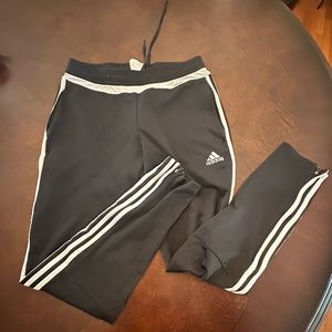 Adidas Pants in black with white side stripes. Size medium, 12-14.
